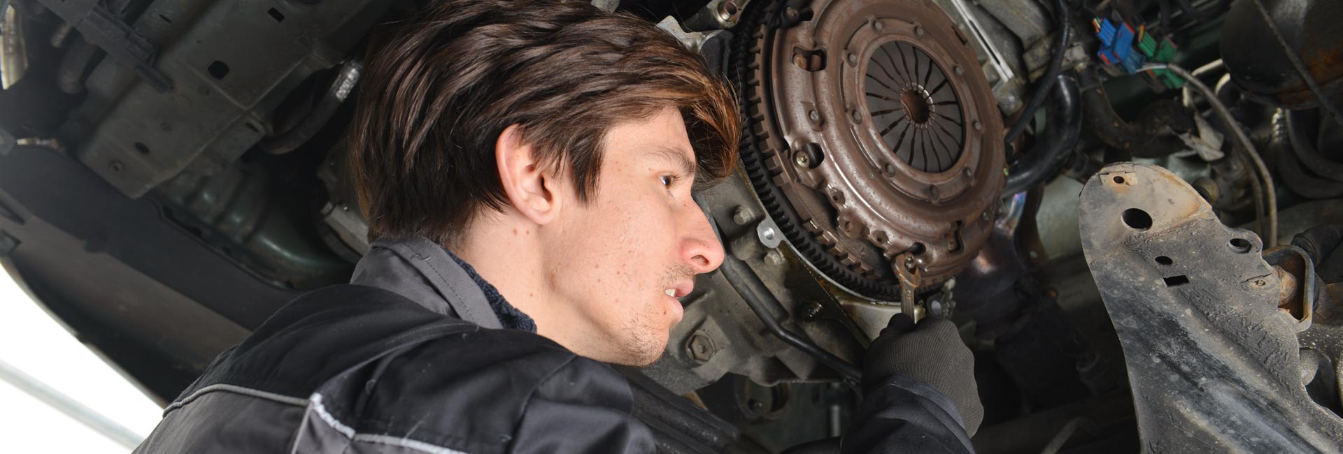 Auto Mechanic Repairing a Car